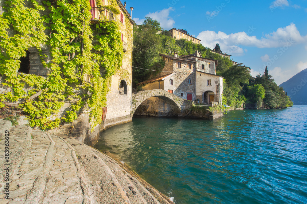 Old stone bridge at the end of Nesso's ravine, Como, Italy
