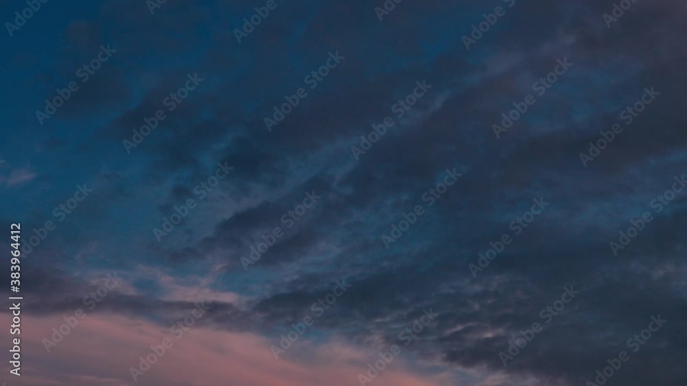 Corrugated clouds flying in the sky at sunset, slightly blurred Corrugated clouds flying in the sky at sunset, slightly blurred