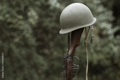 Billede på lærred World War era M1 helmet and rifle