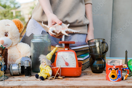 Selling items at the garage sale. Second hands concept. Reusing old stuff