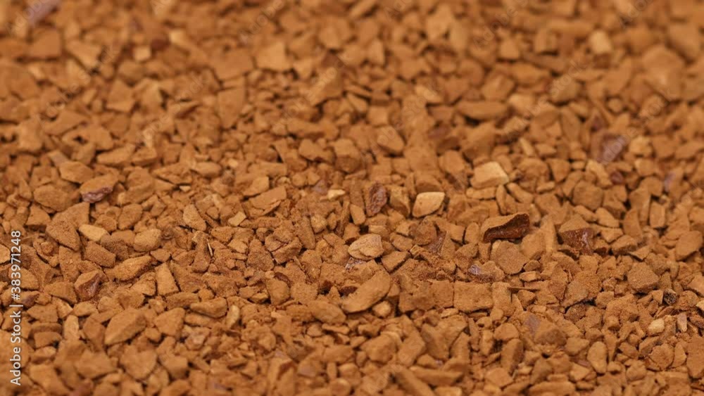 Granules of instant aromatic brown coffee background. Macro shot. Granules of instant aromatic brown coffee background. Macro shot.