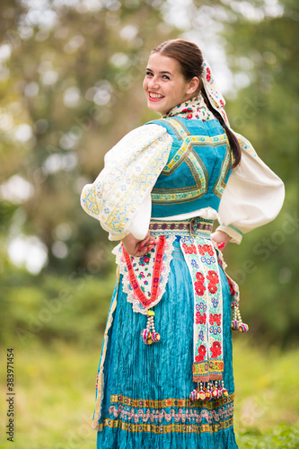 Beautiful young woman in slovak folk dress. Slovak folklore.