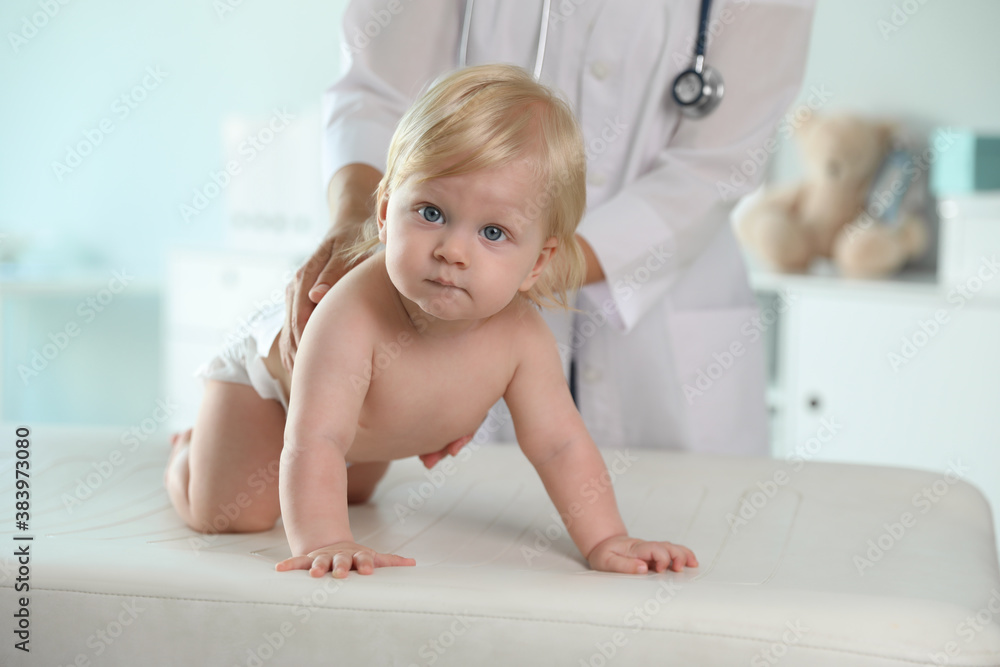 Pediatrician examining baby in hospital. Health care Pediatrician examining baby in hospital. Health care