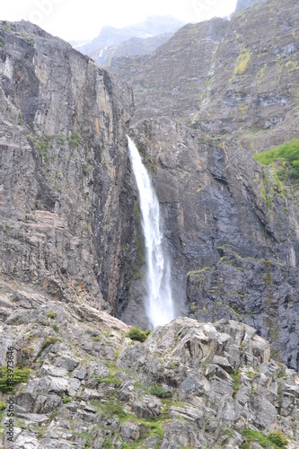 waterfall in foggy mountains