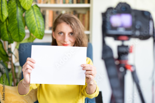 teacher or vlogger recording a lesson on camera online learning