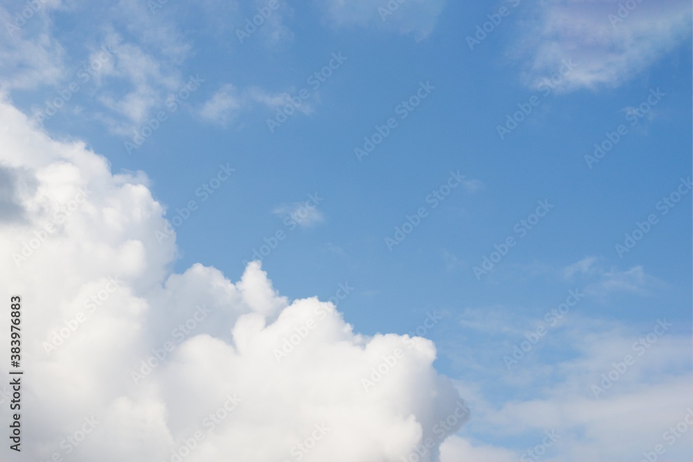 Fototapeta premium Beautiful white fluffy clouds on a blue sky background