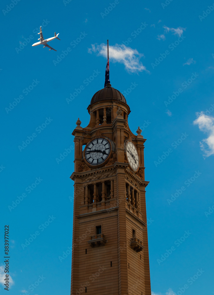 Passenger aeroplane flying over Sydney City CBD Buildings NSW Australia