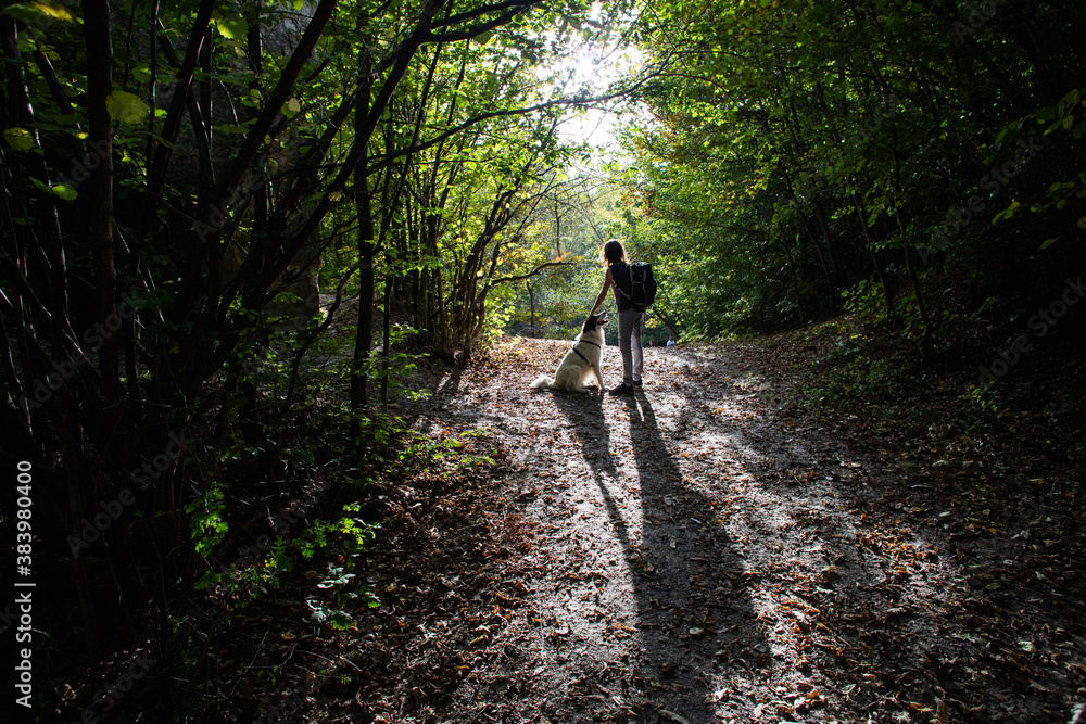 woman and dog enjoying the outdoors social distancing