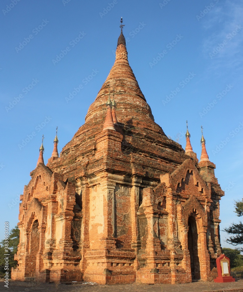 Ruins of stone pagoda with clear blue sky at Bagan, Myanmar