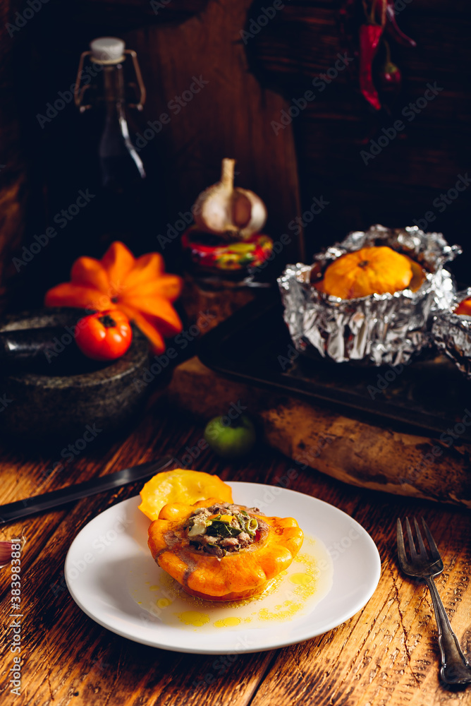Filled pattypan squash on white plate Filled pattypan squash on white plate