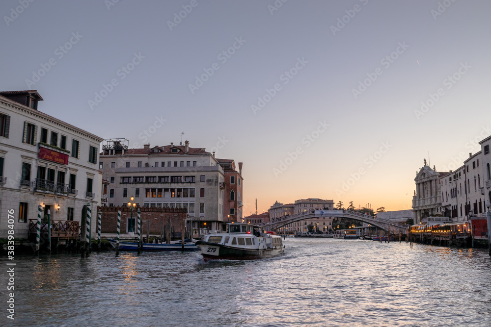 Heading up the the Grand Canal towards Ponte dell'Accademia with the sun setting in the distance
