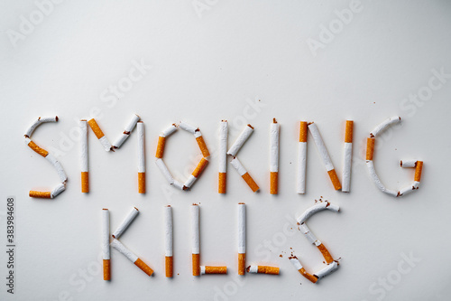 Inscription word SMOKIN KILLS made out of cigarettes top view