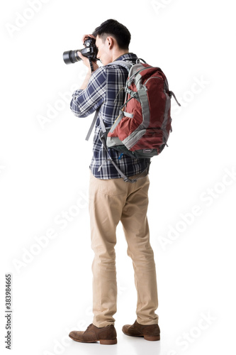 Asian young male backpacker take a picture