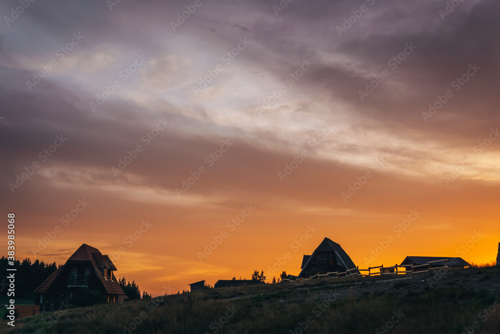 sunrise over the old houses on the mountain