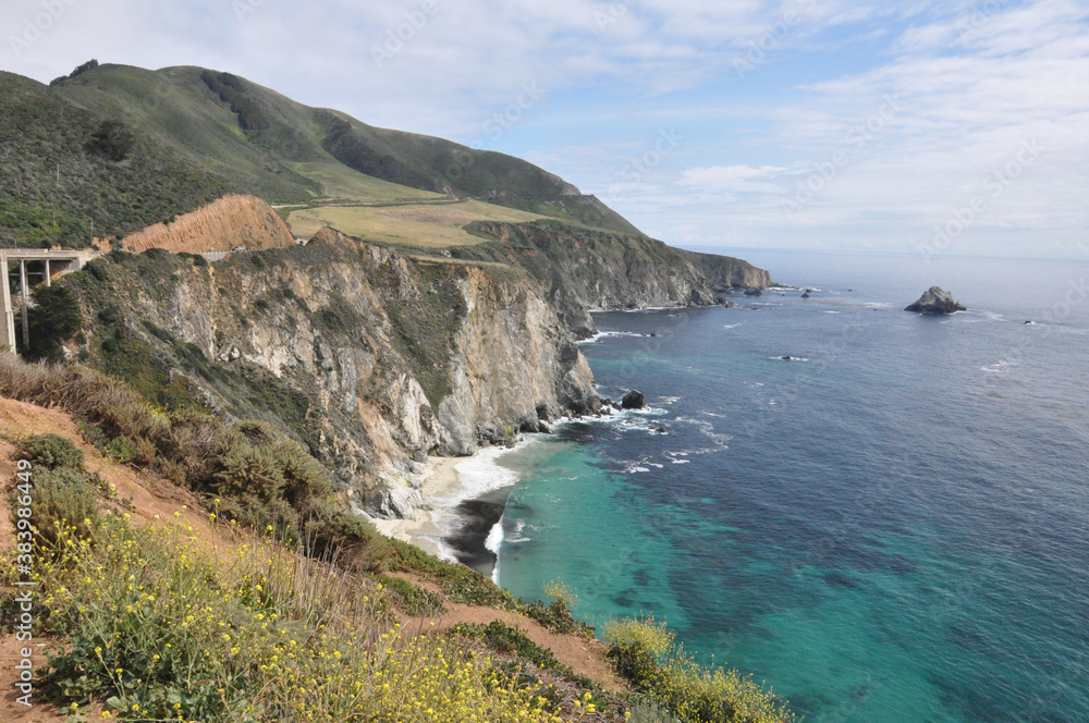 Landscape view of Bixby Creek Bridge  and the suggest coast of Big Sur along the Pacific Coast Highway