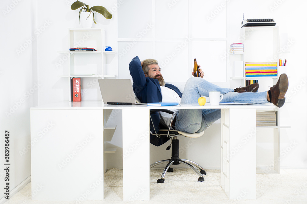 Depressed businessman has problem at work, drinking alcohol in office. Drunk man at the end of the working day.