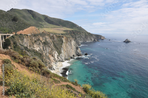 Landscape view of Bixby Creek Bridge and the suggest coast of Big Sur along the Pacific Coast Highway