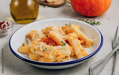 Creamy roasted butternut pumpkin tortiglioni pasta with parmesan cheese and thyme.