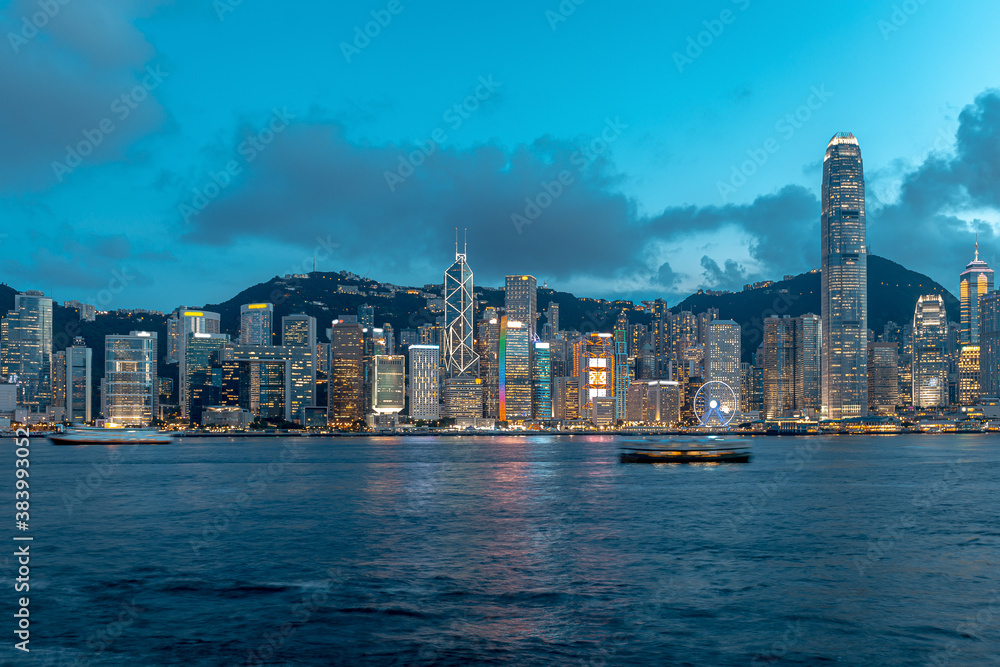 Naklejka premium Cityscape and skyline at Victoria Harbour in Hong Kong city
