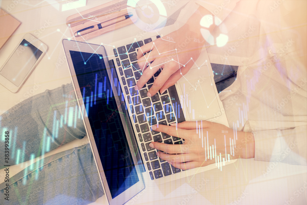 Double exposure of woman hands working on computer and forex graph hologram drawing. Top View. Financial analysis concept. Double exposure of woman hands working on computer and forex graph hologram drawing. Top View. Financial analysis concept.