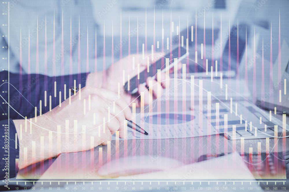 Double exposure of man's hands holding and using a digital device and forex graph drawing. Financial market concept. Double exposure of man's hands holding and using a digital device and forex graph drawing. Financial market concept.