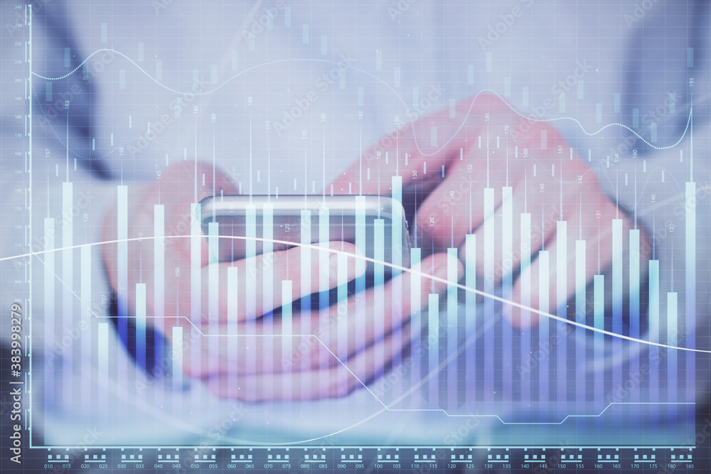 Double exposure of man's hands holding and using a digital device and forex graph drawing. Financial market concept. Double exposure of man's hands holding and using a digital device and forex graph drawing. Financial market concept.