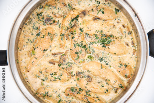 Creamy Herb Mushroom Chicken with steamed rice, dill and parsley in the pan shot from above
