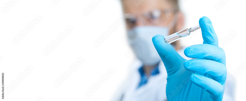 Doctor holding a viol with vaccine against corona virus. Doctor holding a viol with vaccine against corona virus.