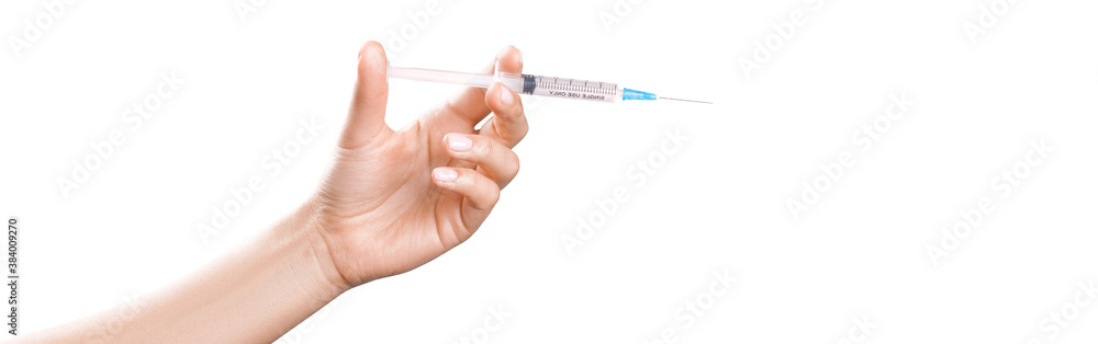 Hand holding syringe with vaccine against corona virus. Hand holding syringe with vaccine against corona virus.