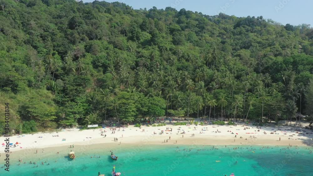 View from above, stunning aerial view of a tropical white sand beach bathed by a turquoise, clear water. Freedom beach, Phuket, Thailand. View from above, stunning aerial view of a tropical white sand beach bathed by a turquoise, clear water. Freedom beach, Phuket, Thailand.