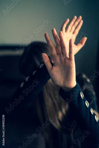Close up on hands of unknown caucasian woman opened in front of her head to protect from strike - Domestic violence and sexual harassment female abuse human rights concept