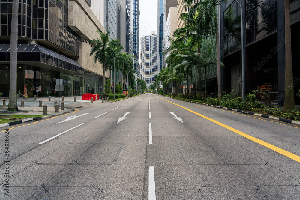 Quiet Singapore street with less pedestrians and cars during the pandemic of Coronavirus disease (COVID-19).