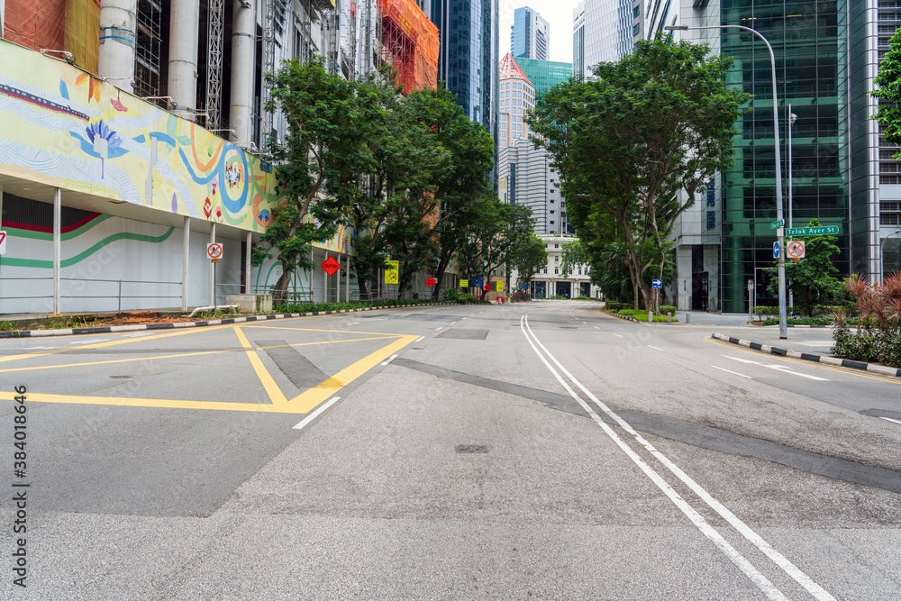 Quiet Singapore street with less pedestrians and cars during the pandemic of Coronavirus disease (COVID-19).