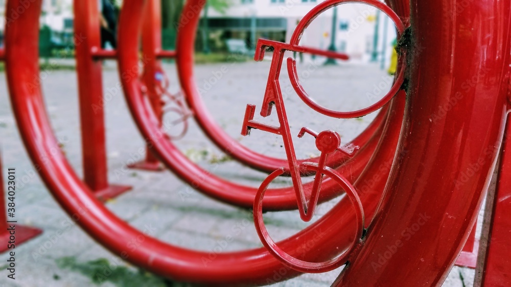 Red bike rack in a an urban setting. Red bike rack in a an urban setting.