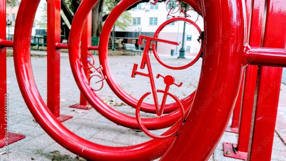Red bike rack in a an urban setting.