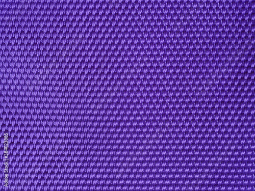 abstract purple fabric texture blur background with closeup surface and fiber of silk for wallpaper and pattern design
