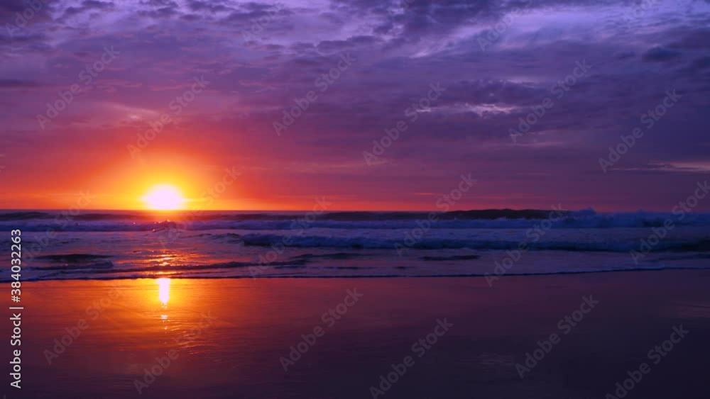 Sandy beach with waves lapping in the sunset With the shadows falling on the sun at Phuket Thailand. 4K Footage with audio. Sandy beach with waves lapping in the sunset With the shadows falling on the sun at Phuket Thailand. 4K Footage with audio.