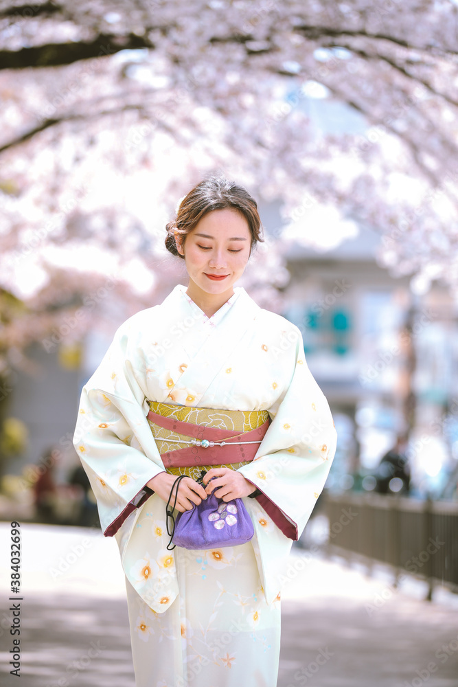 Girls Wearing Kimono with cherry blossoms in spring, Kyoto, Japan Girls Wearing Kimono with cherry blossoms in spring, Kyoto, Japan