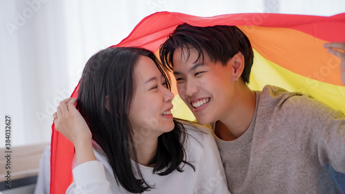 Lesbian couple under rainbow flag