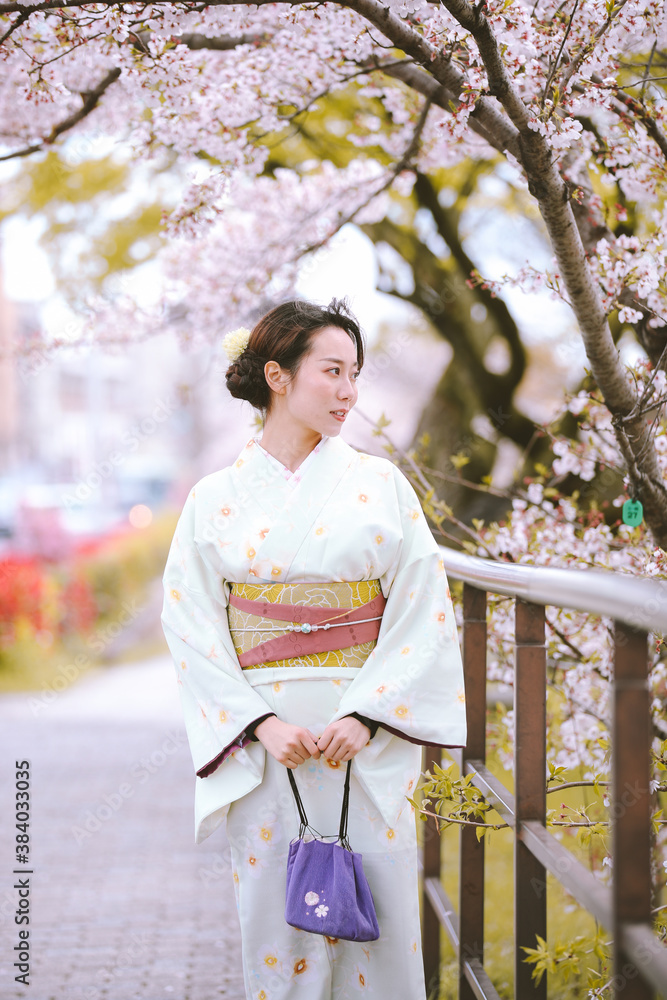 Girls Wearing Kimono with cherry blossoms in spring, Kyoto, Japan Girls Wearing Kimono with cherry blossoms in spring, Kyoto, Japan