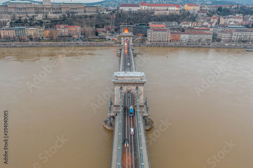 Aerial drone shot of Chain bridge before sunrise at dawn w Royal Palace on buda hill photo