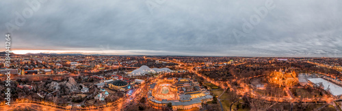 Aerial pano drone shot of Szechenhyi thermal bath center in Budapest winter dusk with lights