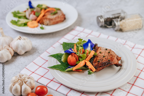 Pork Steak with Tomato  Carrot  Red Onion  Peppermint  Butterfly Pea Flower  and Lime.