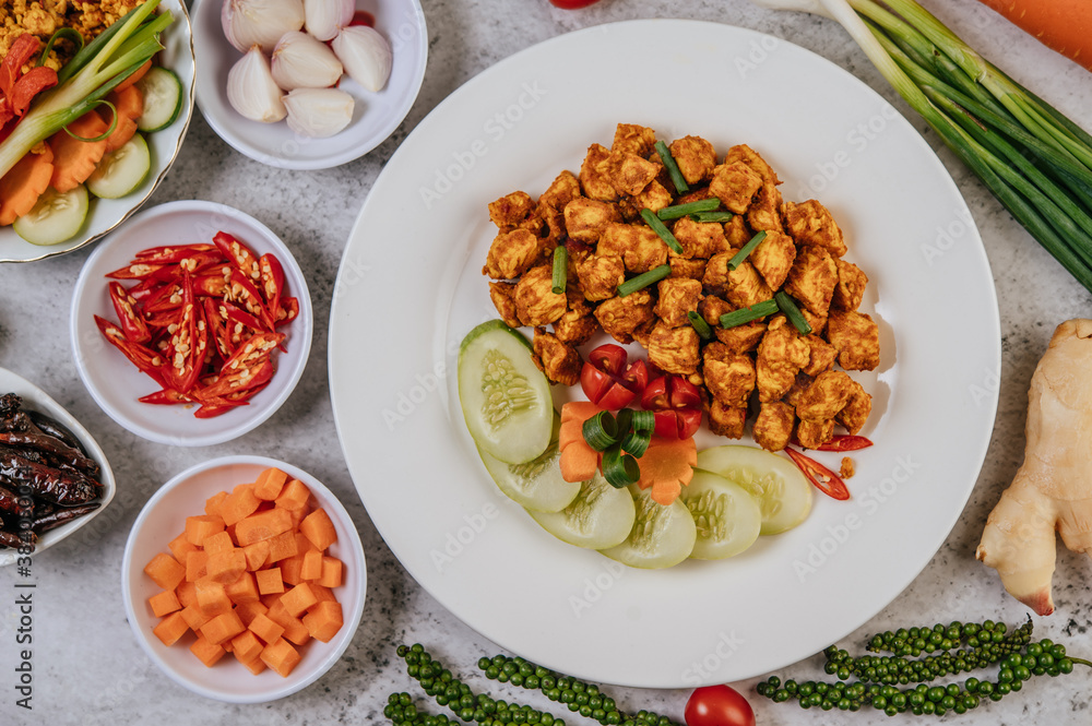 Herbs Fried chicken with Chili, Tomato, Cucumber, Carrot, and Fresh pepper. Herbs Fried chicken with Chili, Tomato, Cucumber, Carrot, and Fresh pepper.