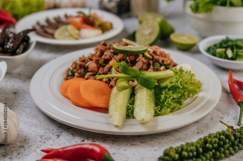 Pork Larb with carrot, cucumber, lime, spring onion, chili, freshly ground pepper, and lettuce Pork Larb with carrot, cucumber, lime, spring onion, chili, freshly ground pepper, and lettuce