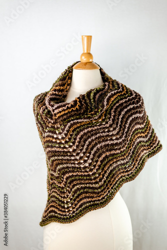 Multicolor knitted scarf with the ornaments 