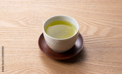 Green tea on a wooden tray.