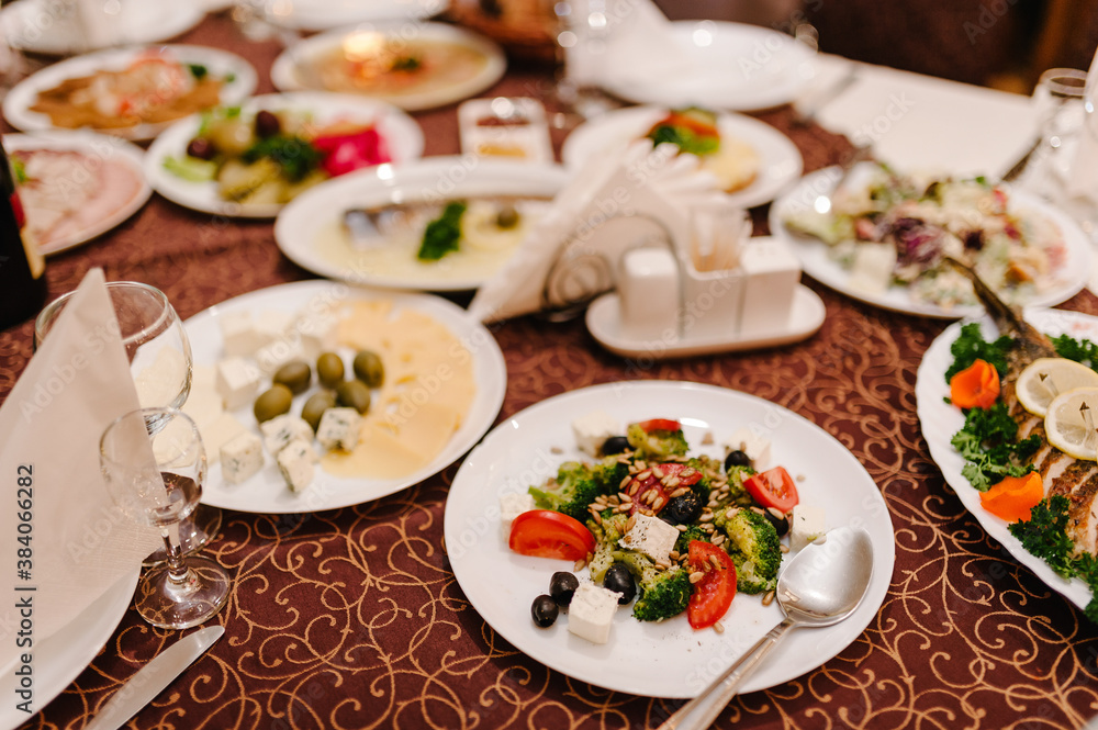 A table with cutlery, food, wine for people to celebrate. Concept of dining lunch. Business Lunch Concept. flat lay. top view.