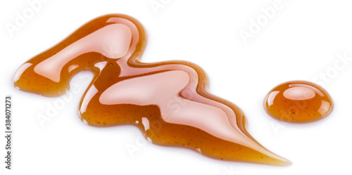 Sweet sugar caramel sauce curls isolated on white background. Top view.