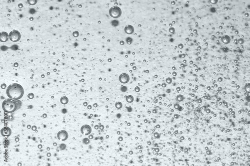 liquid texture close up with oxygen bubbles toned